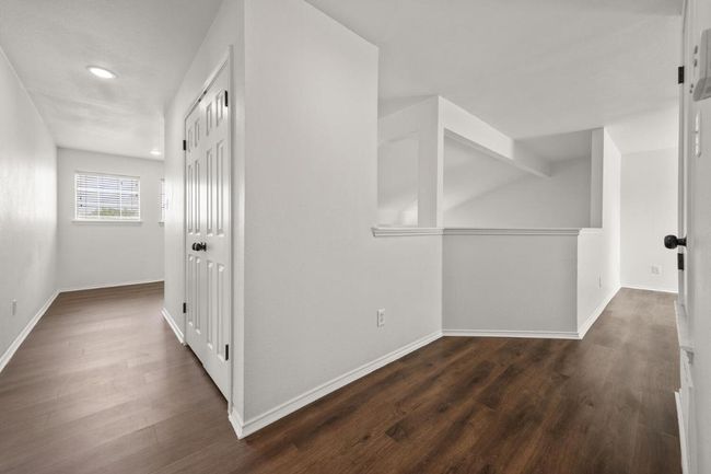 Hall with baseboards, recessed lighting, and dark wood finished floors | Image 15