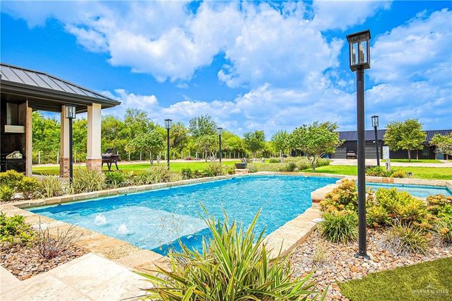 View of swimming pool 20x42 ft custom stone finish Spa:6x12 ft elevated, gas heated | Image 34
