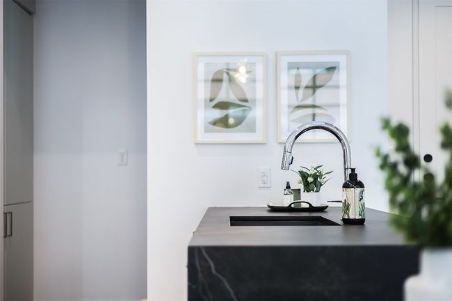 A deep sink with a modern fixture anchors the space and handles everything from prep to cleanup | Image 13