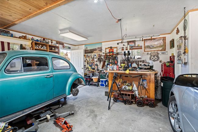 Garage with a workshop area | Image 7