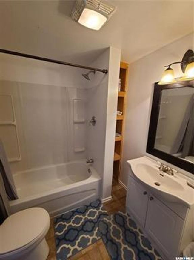 Full bathroom featuring vanity, toilet, shower / tub combination, and tile patterned flooring | Image 34