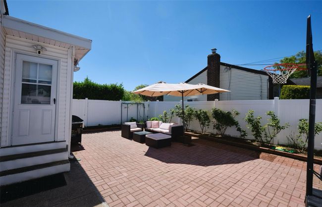 View of patio / terrace featuring a fenced backyard, outdoor lounge area, and entry steps | Image 23