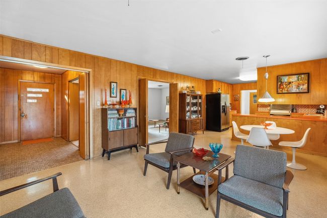 Living area with wooden walls | Image 24