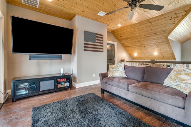 Living room featuring ceiling fan, dark hardwood / wood-style flooring, vaulted ceiling, and wooden ceiling | Image 27