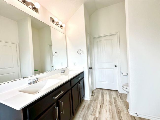 Ensuite has abundant natural light and storage, including linen closet. | Image 16