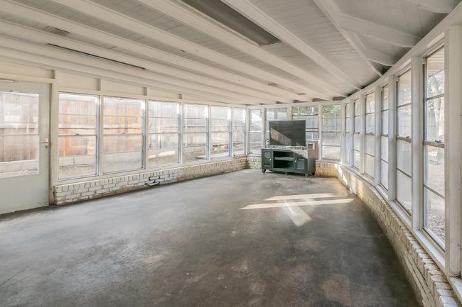 View of unfurnished sunroom | Image 11
