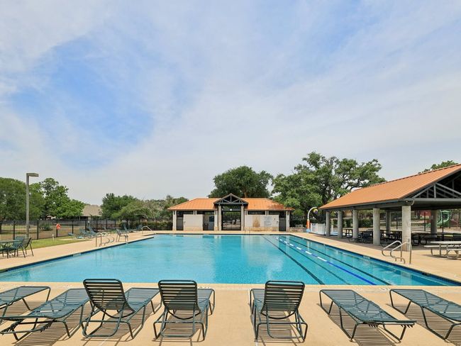Community pool with a gazebo, fence, and a patio area | Image 35