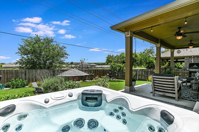 View of patio / terrace with a ceiling fan | Image 29