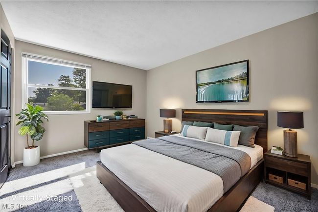 Bedroom with carpet floors and baseboards | Image 16