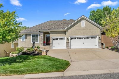 View of front of home with a garage and a front lawn | Image 3