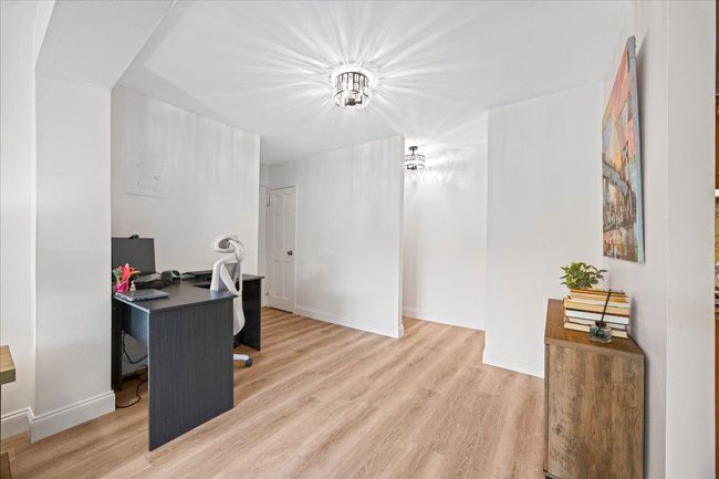 Office with light wood-style flooring and baseboards | Image 17