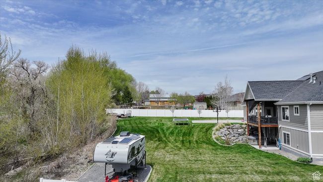 View of yard featuring fence | Image 20