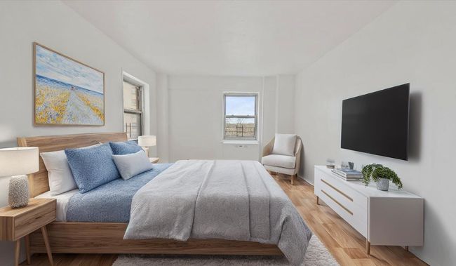 Bedroom with light wood finished floors | Image 8