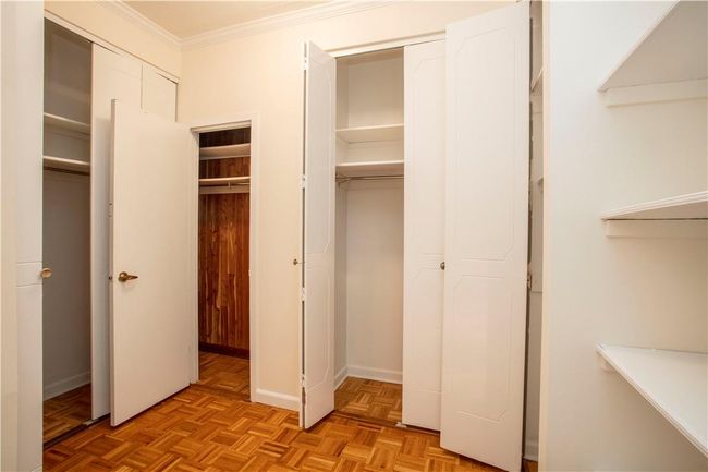 The Huge Bedroom is almost out-done by the size of the Dressing area complete with FIVE closets, including a cedar closet, plus a floor to ceiling wall of shelves. | Image 19