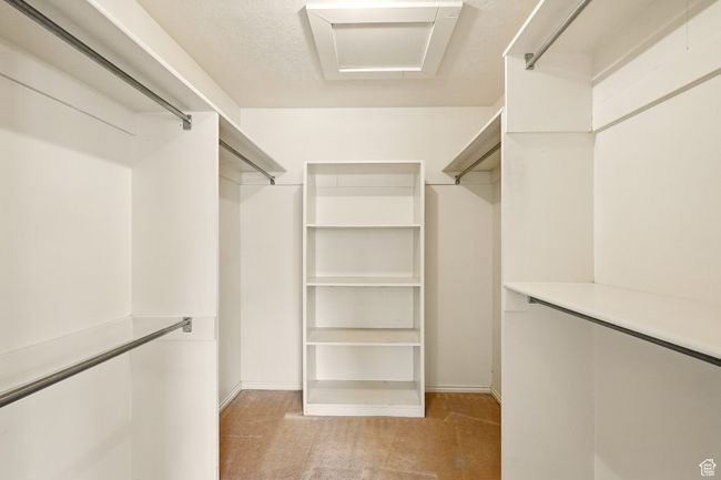 Spacious closet with light carpet | Image 20