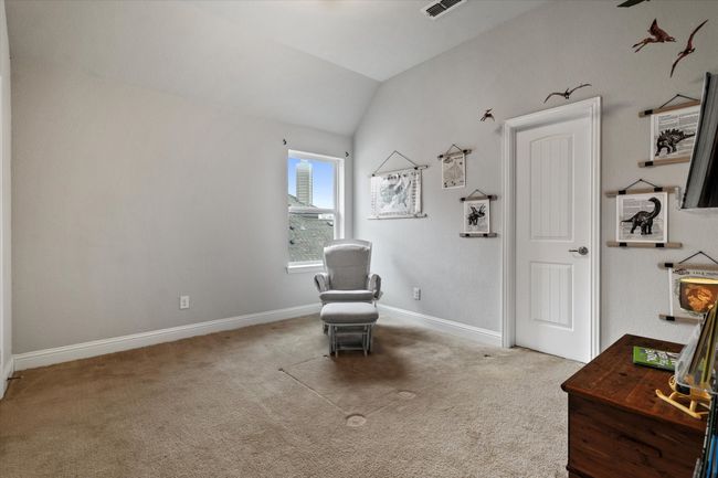 Sitting room featuring carpet flooring and lofted ceiling | Image 32