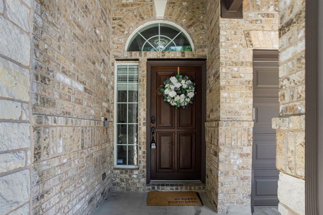 Doorway to property with stone siding | Image 10