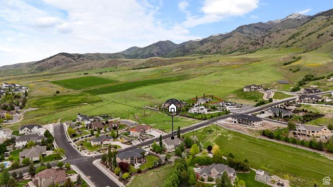 Aerial view of property and surrounding area featuring mountains and nearby suburban area | Image 4