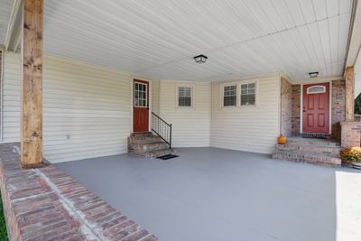 Large carport and covered front porch with new door. | Image 3