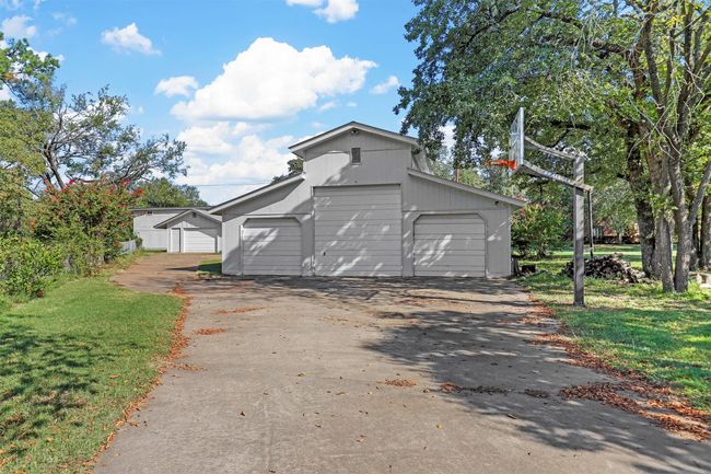 Garage featuring a lawn | Image 34