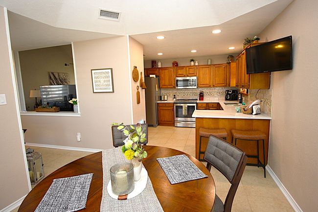 Dining space with recessed lighting, baseboards, and light tile patterned flooring | Image 17