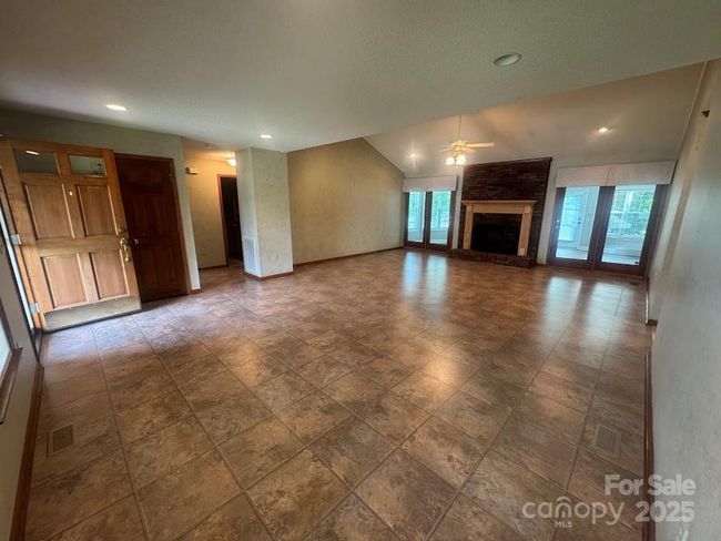 Ceiling fan/ natural light and 2 french doors that lead to sunroom | Image 8