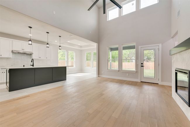 natural light filling living room ad kitchen, with expansive views of the backyard. | Image 6