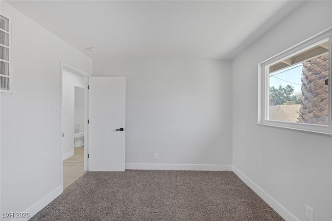 Carpeted spare room featuring baseboards | Image 23
