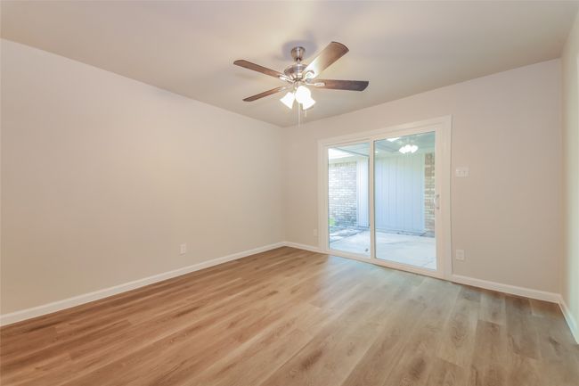 Spare room with light wood-style floors and a ceiling fan | Image 14