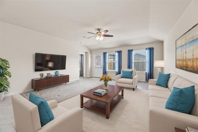 The expansive living area is bathed in natural light, creating a warm and welcoming atmosphere—perfect for relaxing, entertaining, and making lasting memories with family | Image 9