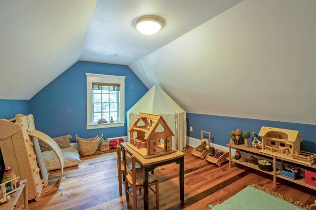 Rec room featuring wood finished floors and vaulted ceiling | Image 32