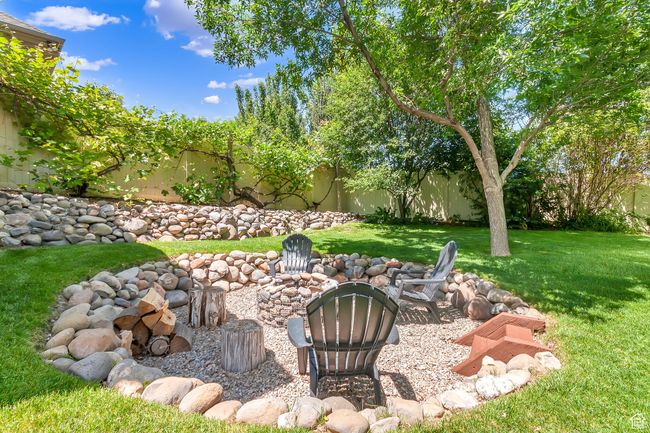 View of yard with an outdoor fire pit | Image 58