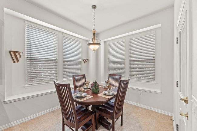 Dining room with baseboards and light tile patterned floors | Image 21