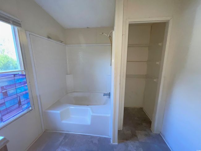 Bathroom featuring shower / bathing tub combination | Image 10