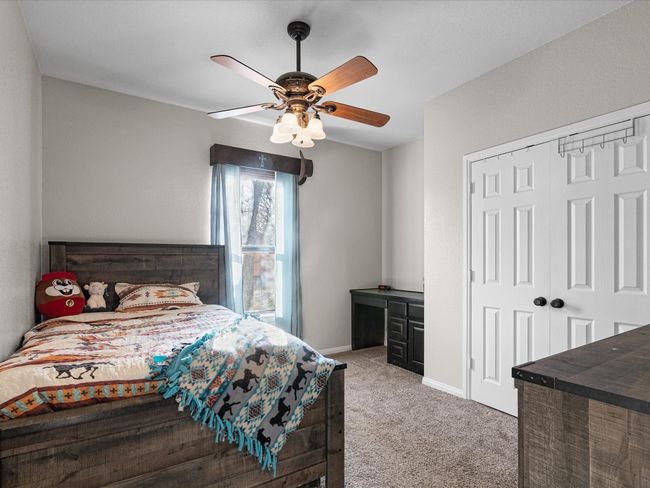 Bedroom 1 with a built in desk | Image 18