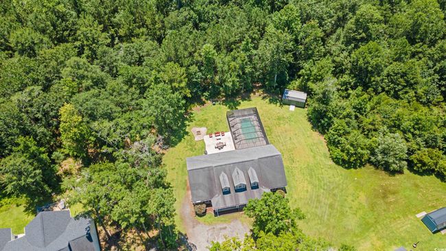 Aerial view of a heavily wooded area | Image 36