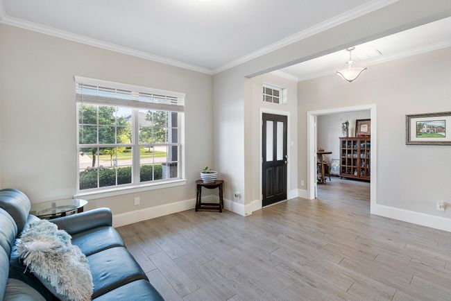 A versatile space designed for gatherings or cozy evenings—bathed in natural light and filled with a warm, welcoming atmosphere. | Image 7