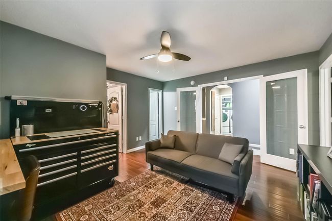 French doors open to an amazing flex space -- could be used for a playroom, office or den! | Image 4