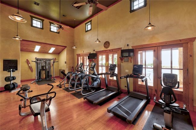 Situated in the sought-after Northshore at The Hollows, this home grants access to resort-style amenities at the Beach Club, including a 24-hour fitness center. | Image 40
