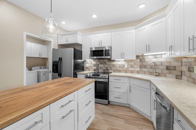 Plenty of counter space, and granite countertops. | Image 1