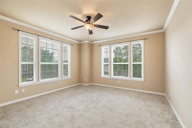 Each secondary bedroom offers a comfortable and quiet retreat, freshly painted in 2024 to create a clean, modern feel. Soft carpeting was replaced in 2023, adding warmth and comfort underfoot. With spacious layouts and ample closet storage, these rooms are ideal for family, guests, or a flexible home office. | Image 37