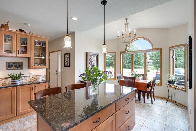 Gorgeous granite countertop and extra storage in the island. | Image 16