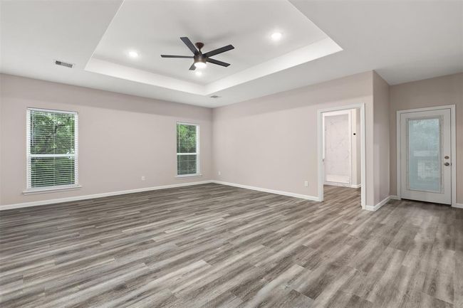 Primary suite includes access to the back patio | Image 15
