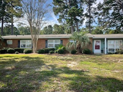 Single story home featuring a front lawn | Image 1