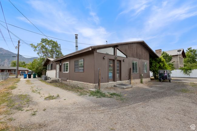 View of property exterior with dirt driveway | Image 34