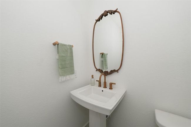 Convenient half bath adjacent to the study, perfect for guests. | Image 19