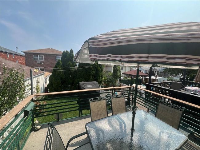 View to backyard from deck | Image 30