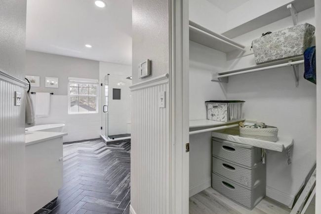 Spacious closet featuring parquet flooring | Image 19