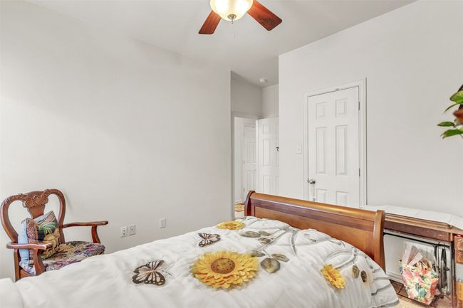 Bedroom featuring ceiling fan | Image 10
