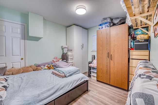Bedroom featuring light wood-style floors | Image 25